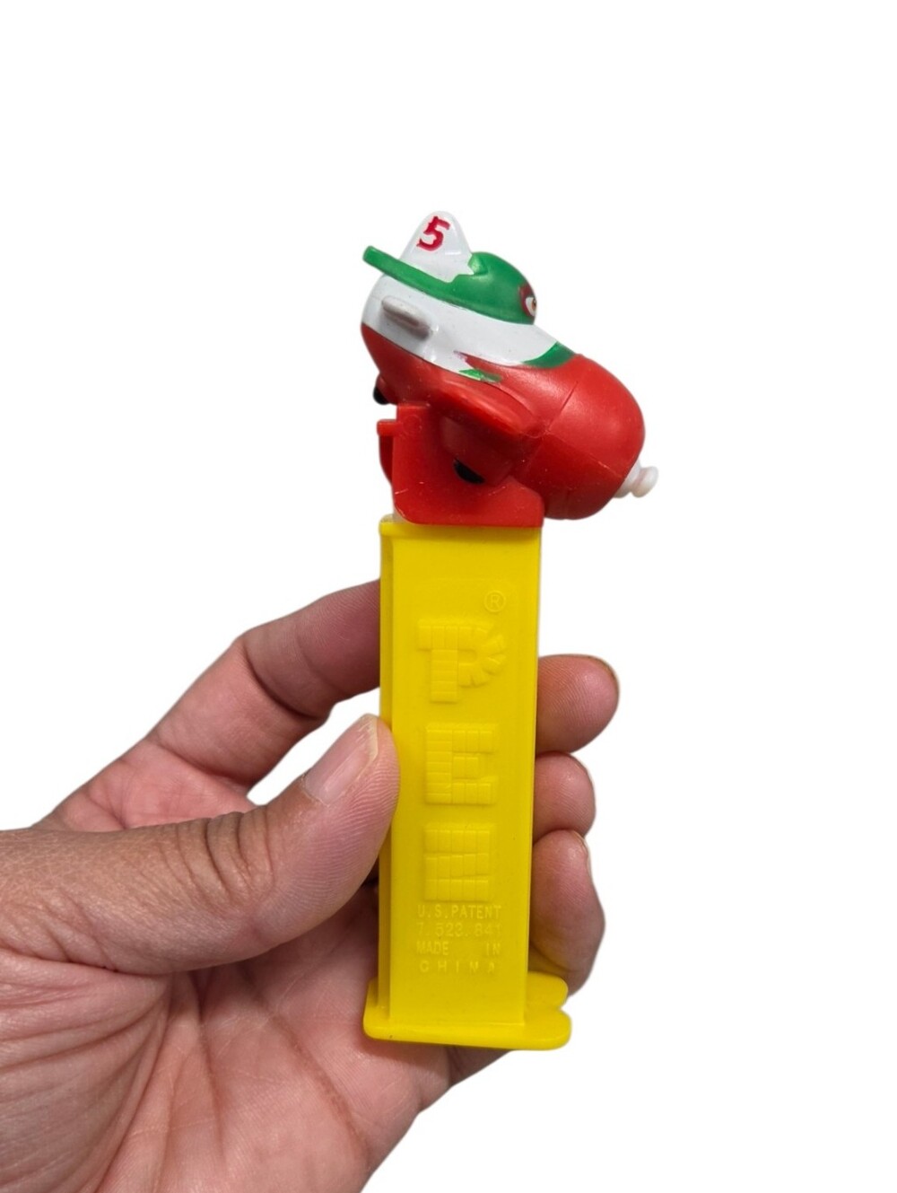 2014 Disney El ChupacabraYellow Candy Dispenser with Red & Green Airplane Top
